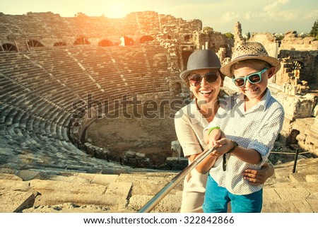 Mother with son take a selfie photo in antique theatre