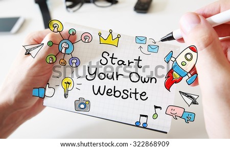 Mans hand drawing Start Your Own Website concept on white notebook
