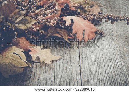 Autumn Leaves on Rustic Wood Background with Instagram Style Filter