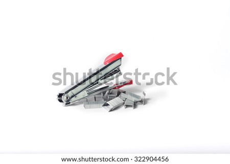 Stapler with staples wires on white background.