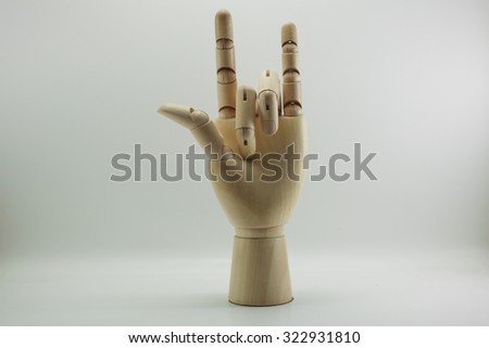 Wooden dummy hand point sign isolated white background