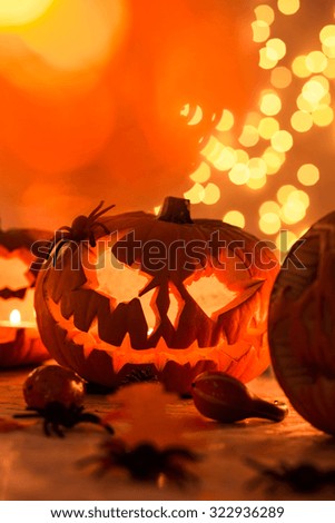 Carved orange halloween pumpkin on the table