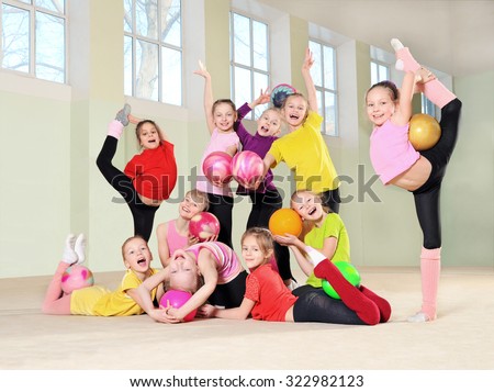 Group of young gymnasts in gym
