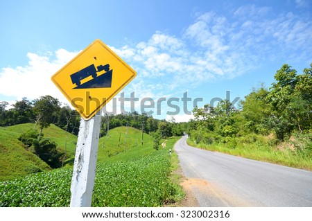 Road sign with green mountain background