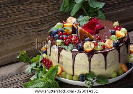close-up of juicy fruit cake Rustic Style on  background of an old tree studio