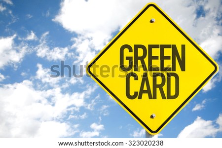 Green Card sign with sky background
