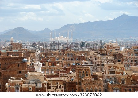 Old city of Sanaa the capital of Yemen. View on the city from roof at sunrise Royalty-Free Stock Photo #323073062