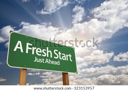 A Fresh Start Green Road Sign With Dramatic Clouds and Sky. Royalty-Free Stock Photo #323153957