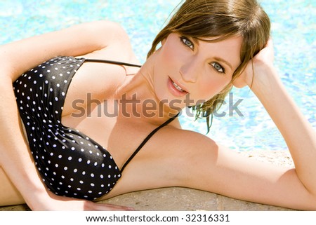 Woman at the Edge of a Swimming Pool