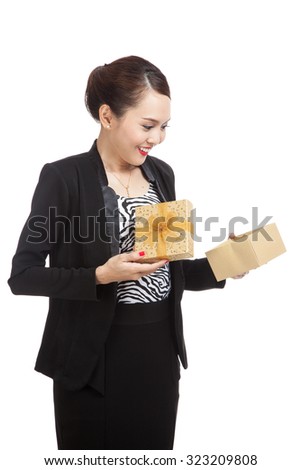 Young Asian business woman open a golden gift box  isolated on white background