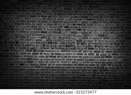 Black and white ackground of old vintage brick wall Royalty-Free Stock Photo #323273477