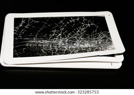 white broken tablet on black background