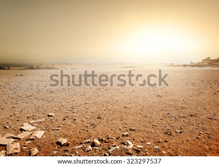 Sandy desert in Egypt at the sunset Royalty-Free Stock Photo #323297537