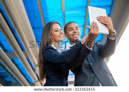 young business team outdoors taking a selfie  