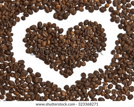 heart made of coffee beans isolated on white background
