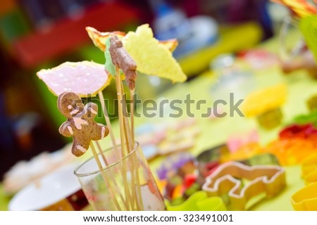 Picture of gingerbread cookies in glass close up over light table background
