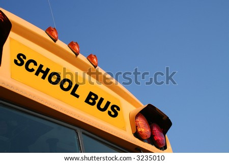 Yellow school bus against a blue sky