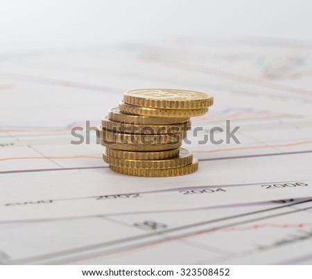 Pile of coins on business documents background