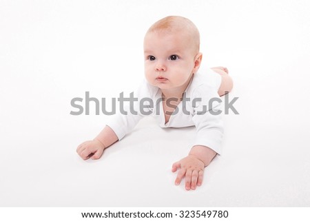 Baby girl on a white background, picture with depth of field