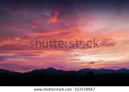 Dark sky and orange clouds on the mountain Silhouette