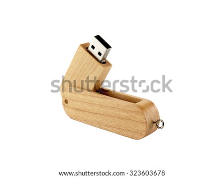 close-up single beige wooden usb flash drive isolated on white background, connected or peripheral device design with wood and foldable for storage and transferring digital data and used as key chain
