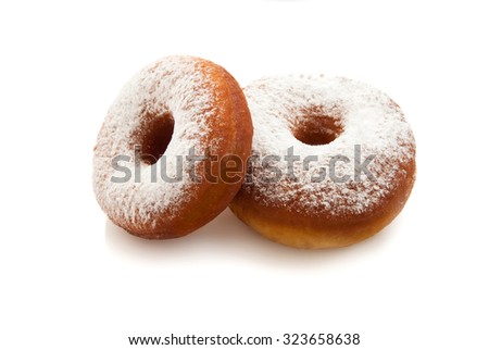 Donuts isolated on white background with icing sugar