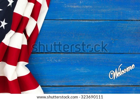 Welcome sign with American flag on antique rustic royal blue wooden background