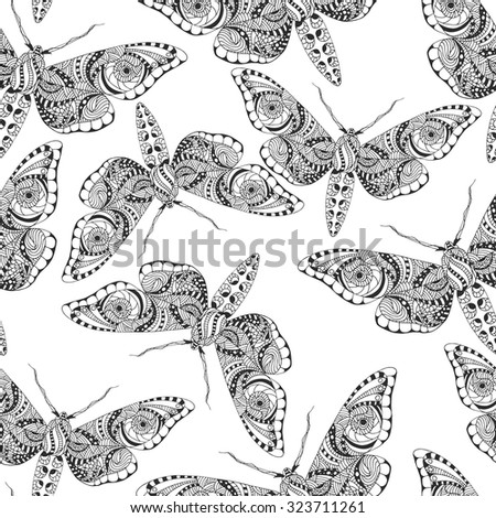 Seamless pattern with butterflies. Hand drawn doodle. Vector illustration