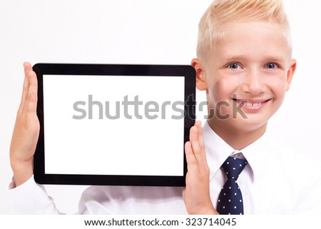 smiling student in a shirt and tie on a white background holding a tablet, picture with depth of field, selective focus on the tablet.