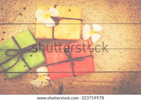 gift box from nature and flower on wooden background, vintage color tone. for Christmas and Happy new year.