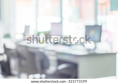 Abstract business blurred in the workplace or work space of table work in office with computer or shallow depth of focus as corporate interior background.
