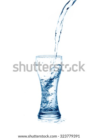 pouring water splash into glass isolated on white background