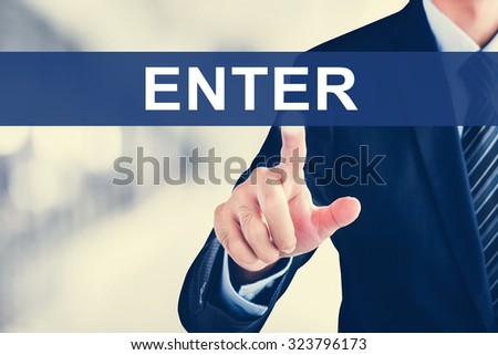 Businessman hand touching  ENTER tab on virtual screen