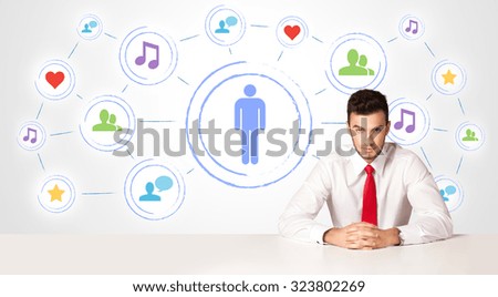 Businessman sitting at white table with social media connection background