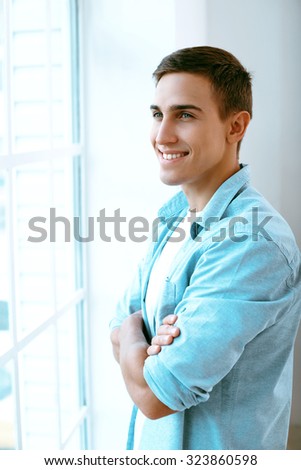 Professional photographer smiling in office