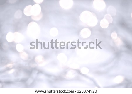 Christmas lights garland on a white wooden background