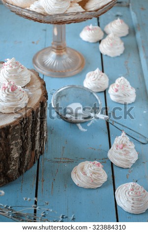Marshmallow on wooden stand and blue rustic background.
