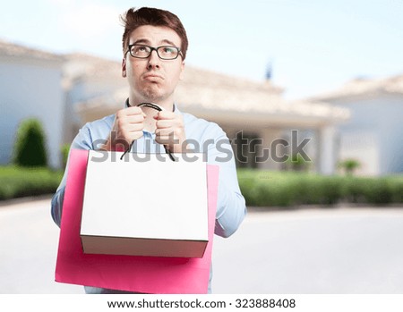 boring young man with shopping bags