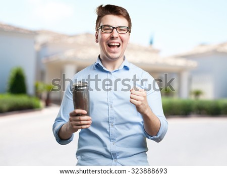 young man with beer celebrating pose
