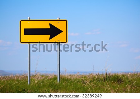 road sign at the end of a rural road - right turn only one way