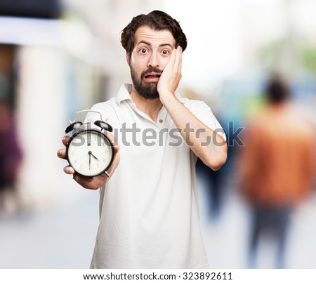 worried young man with clock