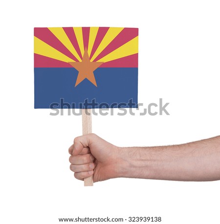 Hand holding small card, isolated on white - Flag of Arizona