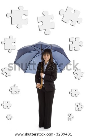 Young businesswoman with umbrella and puzzle pieces isolated in white background