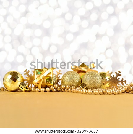 Golden Christmas decorations on a silvery background