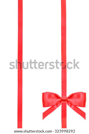 one red satin bow in lower right corner and two vertical ribbons isolated on vertical white background