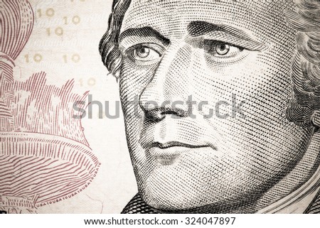Close up to Alexander Hamilton portrait on ten dollar bill. Toned.