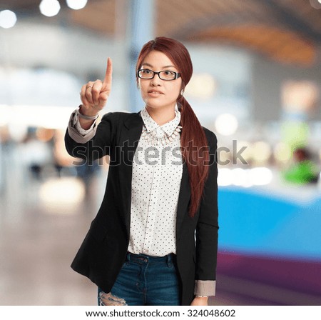 happy chinese woman touching screen sign