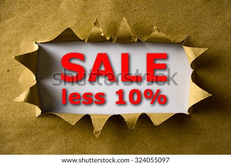 Torn brown paper with SALE LESS 10% words