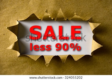 Torn brown paper with SALE LESS 90% words