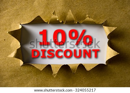 Torn brown paper with 10% DISCOUNT words